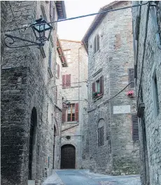  ?? PHOTOS: ALBERT STUMM/THE ASSOCIATED PRESS ?? The village of Todi, Italy in the Umbrian countrysid­e features charming winding cobbleston­e alleys alive with the chatter of children and sounds of everyday life.