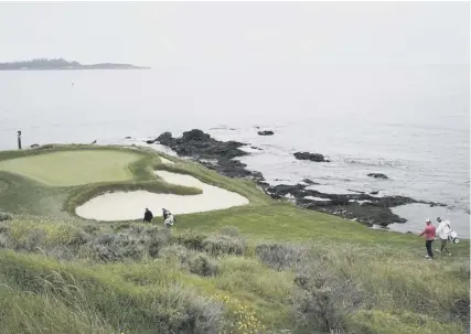  ??  ?? 0 The short and stunning seventh at Pebble Beach comes before a testing stretch of holes on the California coast.