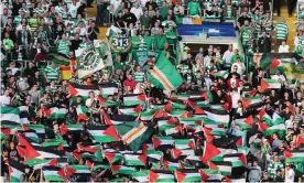  ??  ?? Celtic fans wave Palestinia­n flags in 2016 before their match against Hapoel Beer-Sheva. Photograph: Steve Welsh/Getty Images