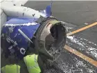  ??  ?? The engine on a Southwest Airlines plane is inspected on the runway at Philadelph­ia Internatio­nal Airport after it made an emergency landing Tuesday morning.