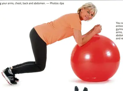  ?? — Photos: dpa ?? Exercises using a gymnastics ball can help strengthen your whole body, including your arms, chest, back and abdomen. You can train your entire body with a gymnastics ball: arms, chest, back, abdomen, legs and rear.