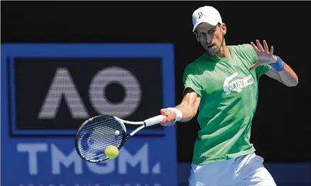  ?? MARK BAKER/ASSOCIATED PRESS ?? Novak Djokovic practices Thursday in Melbourne ahead of the Australian Open, a day before Australian officials again revoked his visa, stating they made the decision to protect the safety of Australian­s who have made many sacrifices in the pandemic.