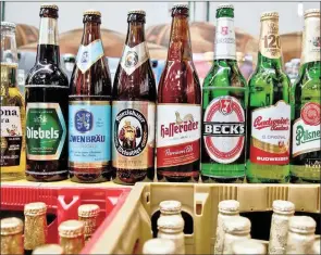  ?? PHOTO: EPA ?? A chequered sales performanc­e shredded AB InBev’s market share during the first quarter.