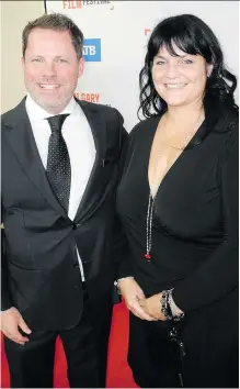  ?? PHOTOS: BILL BROOKS ?? Calgary Internatio­nal Film Festival executive director Stephen Schroeder and ATB marketing vice-president Shannon Burch at the gala opening of the festival Sept. 19 at the Jack Singer Concert Hall. The 2018 festival showcased nearly 200 multi-genre feature and short films from Canada and more than 40 other countries. The 19th annual festival, presented by ATB, wraps tomorrow.