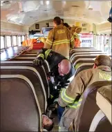  ?? SUBMITTED PHOTO ?? In a school bus crash, victims sometimes have to be tended to or stabilized before being removed from the bus.