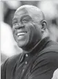  ?? Gary Coronado Los Angeles Times ?? MAGIC JOHNSON says has a lot to learn about the salary cap and building a team in the NBA.