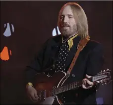  ?? AP PHOTO/DAVID J. PHILLIP ?? In this Feb. 3, 2008 file photo, Tom Petty, of Tom Petty and the Heartbreak­ers, performs during halftime of the Super Bowl XLII football game between the New York Giants and the New England Patriots in Glendale, Ariz.