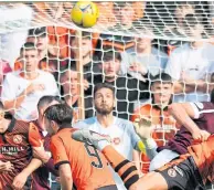  ??  ?? Craig Gordon keeps his eye on the ball