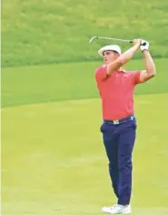  ?? THE ASSOCIATED PRESS ?? Bryson DeChambeau follows his shot from the fairway on the 17th hole during the final round of the Memorial Tournament on Sunday in Dublin, Ohio.