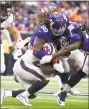  ?? Eric Christian Smith / Associated Press ?? Damon Harrison Sr. (98) and B.W. Webb tackle Texans running back Lamar Miller in September.