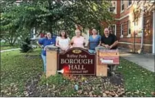  ?? SUBMITTED PHOTO ?? Ridley Park Fall Festival committee members, left to right, Shellie Dalessio, Sue McAtee, Sue Endriss, Danielle Staccone and Bob Berger stand with a Festival sign outside of Ridley Park Borough Hall Thursday.