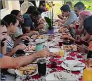  ?? JOANNA HENKE-BROWN ?? Food blogger Jessica Hylton Leckie attends a yearly “Friendsmas” holiday potluck gathering in Jamaica.