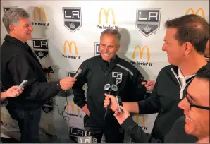  ?? AP PHOTO/GREG BEACHAM ?? Los Angeles Kings interim coach Willie Desjardins reacts to a question from reporters after his first practice with his new team on Monday in Los Angeles. Desjardins is taking over for the fired John Stevens with hopes of improving the Kings' NHL-worst start to the season.