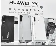  ?? AP ?? New Huawei Technologi­es products are shown on display Tuesday in Tokyo.