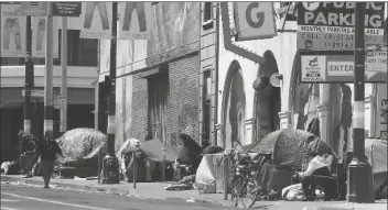  ?? ASSOCIATED PRESS ?? IN THIS APRIL 18, 2020, FILE PHOTO, tents line a sidewalk on Golden Gate Avenue in San Francisco.