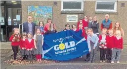  ??  ?? Carmyllie Primary pupils with Andrew Watson of Sportscotl­and, teacher Mrs Joanna Stout, Kelly Moonlight of Active Schools, Bikeabilit­y co-ordinator John Bremner and teacher Samantha Ritchie.