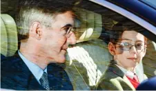  ??  ?? Family outing: Jacob Rees-Mogg and son Peter arrive