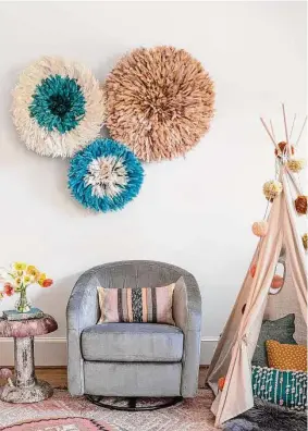  ?? Julie Soefer ?? For a client’s home in Upper Kirby, Houston interior designer Jana Erwin of Nest Design Group found JuJu hats (wall art) and a mushroom table at Courtney Barton and a rug at Heja Home at the Arbors.