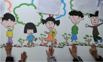  ??  ?? Cartoon images of Junjun (second from right) and his peers in the AIDS Orphan Salvation Associatio­n in Fuyang City of Anhui Province are painted on the wall, on November 30, 2011