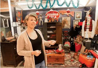  ?? STAFF PHOTO BY TIM BARBER ?? Ryan Bush, owner of Dirty Jane’s Antiques, stands in front of Sue Dillon’s space and talks about the new Dayton Boulevard location for her business where vendors rent space to sell their goods.