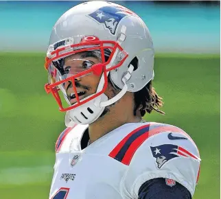  ?? JASEN VINLOVE • USA TODAY SPORTS ?? New England Patriots quarterbac­k Cam Newton reacts prior to Sunday's game against the Miami Dolphins at Hard Rock Stadium in Miami.