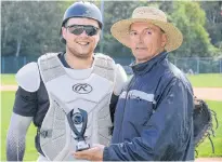  ?? JASON MALLOY/THE GUARDIAN ?? Cornwall’s Logan Gallant receives his rookie of the year award from New Brunswick Senior Baseball League president Tom O’Reilly Sunday at Memorial Field.