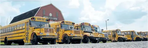  ?? MICHELLE ALLENBERG/WELLAND TRIBUNE ?? School buses are lined up at the Niagara Regional Exhibition grounds in Welland in preparatio­n for the resumption of classes next week.