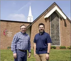  ?? AP photo ?? Rev. Ed McKinney, pastor of Stokesdale United Methodist Church, left, and Michael Hahn (right) pose for a photo at the church in Stokesdale, N.C., on May 15. Hahn and his family are among a group of newcomers who have begun participat­ing in Stokesdale after their previous congregati­ons left the denominati­on.