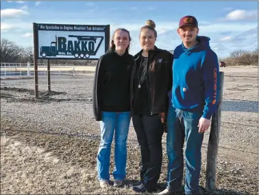  ?? Courtesy ?? With boots on the ground in Nebraska, getting the parts department stocked to serve the Bakko Bros. Nebraska customers are Ashley, Rachel and Austin standing in front of the new sign. The sign was made in the Howards welding shop on Hwy. 2.