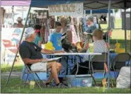  ?? DIGITAL FIRST MEDIA FILE PHOTO ?? Children signed up for the Rotary Club Duck Race together at one of the many vendor exhibits during the GoFourth Festival held last year at Memorial Park.