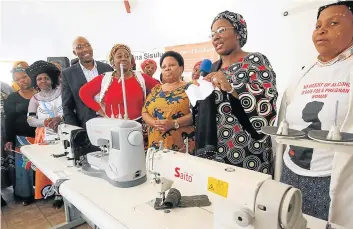  ?? Picture: LULAMILE FENI ?? BIG BOOST: Arts and culture deputy minister Maggie Sotyu, centre, KSD mayor Dumani Zozo, left, AbaThembu Queen Nocollege Dalindyebo, with red top, and Nkosikazi Nobhongo Ngonyama at a handover of 20 industrial sewing machines.