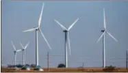  ?? NATI HARNIK — THE ASSOCIATED PRESS FILE ?? In this Nov. 3, 2015file photo, wind turbines dot the landscape near Steele City, Neb. Wind turbines and solar panels accounted for more than two-thirds of all new electric generation capacity added to the nation’s grid in 2015, according to a recent...