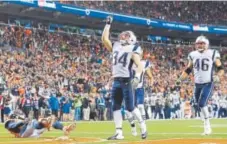  ??  ?? Rex Burkhead of the New England Patriots celebrates his touchdown reception Sunday night.