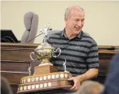  ?? ?? Pat Sullivan receives his St. Catharines sportspers­on of the year award in a ceremony before Monday’s council meeting at city hall.