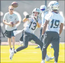  ?? Heidi Fang Las Vegas Review-journal @Heidi Fang ?? Wide receiver Hunter Renfrow catches a pass during Raiders practice on Thursday in Henderson.