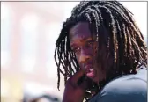  ?? RAY CHAVEZ — BAY AREA NEWS GROUP, FILE ?? Former Falcons defensive end Takk Mckinley, reacts during a 2017 BBQ social event in Richmond. Mckinley, now with the Raiders, was placed on injured reserve Friday.