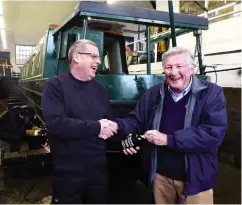  ?? PHOTO: GRAHAM NEWMAN ?? Port out for India: Trevor’s favourite tipple is a glass of fine port. Following his last survey in the large dry dock at Braunston Marina in January 2020, Tim Coghlan (right) presented him with a bottle of Kopke 1999 Vintage Port. Trevor had been surveying narrowboat­s at Braunston Marina since 1997 at, on average, one a week – so roughly of the same vintage.