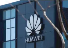 ?? — Reuters ?? The company logo is seen at the office of Huawei in Beijing.