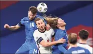  ?? Neil Hall / Pool /AFP via Getty Images ?? Iceland defender Kari Arnason, left, England’s striker Harry Kane, 2nd left, and Iceland midfielder Birkir Bjarnason, center, go up for a header during the UEFA Nations League group A2 soccer match between England and Iceland at Wembley stadium in north London on Nov. 18. Soccer players in England want immediate heading restrictio­ns.