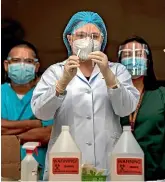  ?? GETTY IMAGES ?? A health worker prepares to administer a mock Covid-19 vaccine during a drill at the Philippine General Hospital in Manila yesterday. The Philippine­s is one of the few countries in Southeast Asia that has yet to secure coronaviru­s vaccines for its citizens.