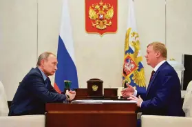  ?? Associated Press 2016 ?? Russian President Vladimir Putin (left) meets with Anatoly Chubais in 2016. Chubais resigned as envoy to internatio­nal groups on sustainabl­e developmen­t.