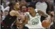  ?? ASSOCIATED PRESS FILE ?? George Hill defends the Celtics’ Marcus Smart. The Cavs will be depending on Hill’s defense against Warriors guard Steph Curry.