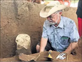 ?? David Kelly For The Times ?? HIGH-TECH gear and reworked texts helped Wichita State’s Donald Blakeslee find possible remnants of Etzanoa, home to thousands, under Arkansas City, Kan.