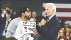  ?? AP PHOTO/MEG KINNARD ?? Democratic presidenti­al hopeful Joe Biden talks with a protester objecting to his stance on deportatio­ns during a town hall at Lander University in Greenwood, S.C., in 2019. President Joe Biden’s administra­tion has deported hundreds of people in its first days in office despite the president’s campaign pledge to halt most deportatio­ns at the beginning of his term.