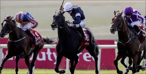  ??  ?? Donnacha O’Brien wins the Dubai Duty Free Irish Derby at the Curragh on Latrobe (centre), from Rostropovi­ch (left) and Saxon Warrior (right).