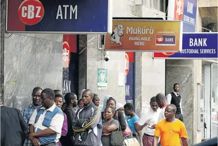  ?? /PHILIMON BULAWAYO / REUTERS ?? Long queues at the banks have become part of life in Zimbabwe as the economic situation in the southern Africa country gets worse.