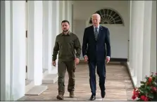  ?? EVAN VUCCI, POOL — THE ASSOCIATED PRESS ?? President Joe Biden and Ukrainian President Volodymyr Zelenskyy walk to the Oval Office of the White House, last Thursday.