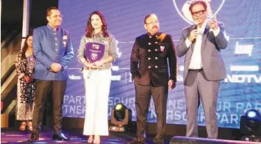  ??  ?? ↑
Sunny Leone (second left) along with dignitarie­s during the event to unveil the jersey of Delhi Bulls.