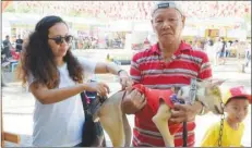  ?? Photo) (Negros Occidental Provincial Veterinary Office ?? A pet owner lets his dog get an anti-rabies shot during one of the vaccinatio­n activities of the Provincial Veterinary Office in Negros Occidental.