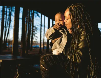  ?? KENDALL WARNER/STAFF ?? Shavyonne Vick holds 1-year-old son Kash Wilson at Chesapeake City Park. Vick was pregnant with Kash while incarcerat­ed and had to have an emergency C-section when her and her son’s life were at risk.